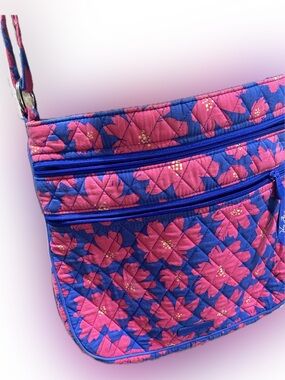 Vera Bradley double zip crossbody purse with adjustable strap.